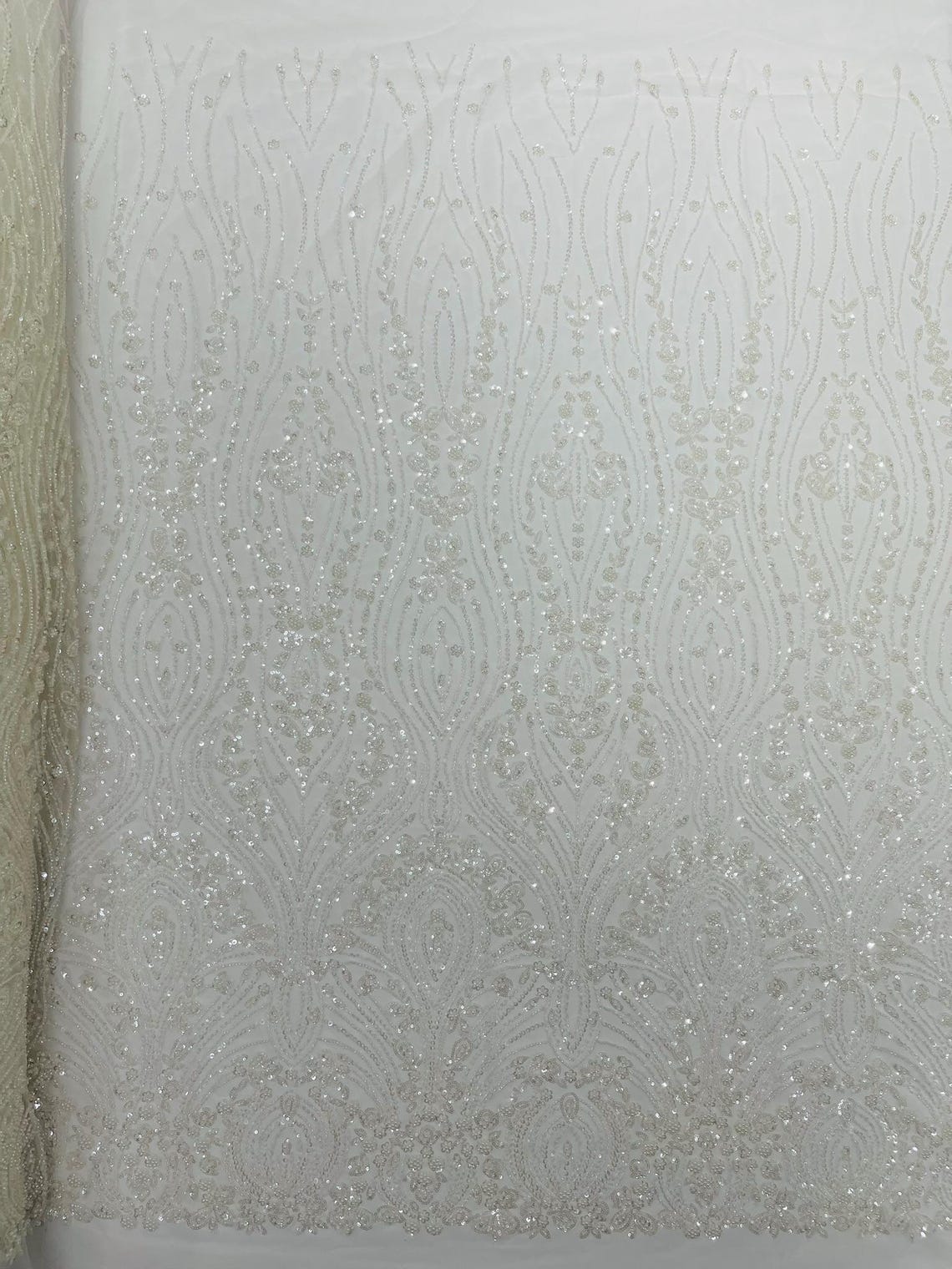 FEATHER  - IVORY - Designs Embroider with Sequins and Heavy Beaded on a Mesh Lace Fabric - Sold By The Yard