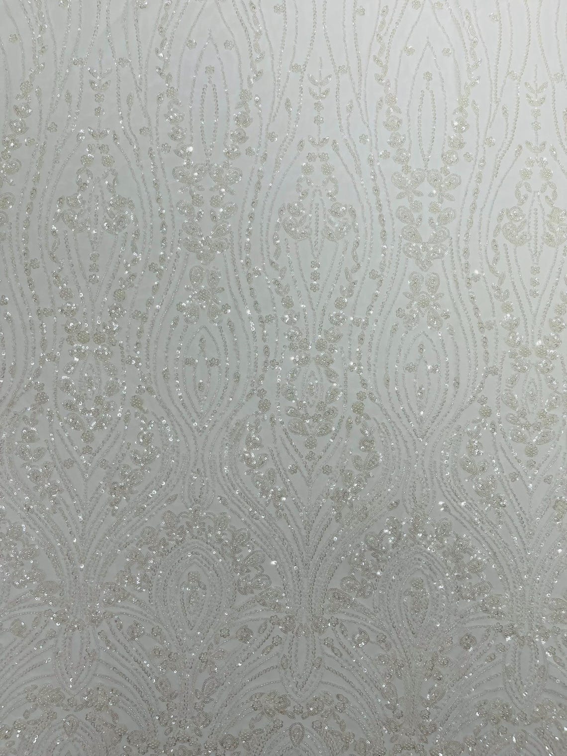 FEATHER  - IVORY - Designs Embroider with Sequins and Heavy Beaded on a Mesh Lace Fabric - Sold By The Yard